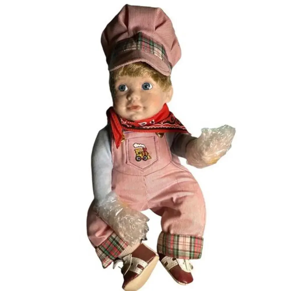 Doll Vintage from the 1990s Materials: Bisque Porcelain, Fabric, Wood About this
